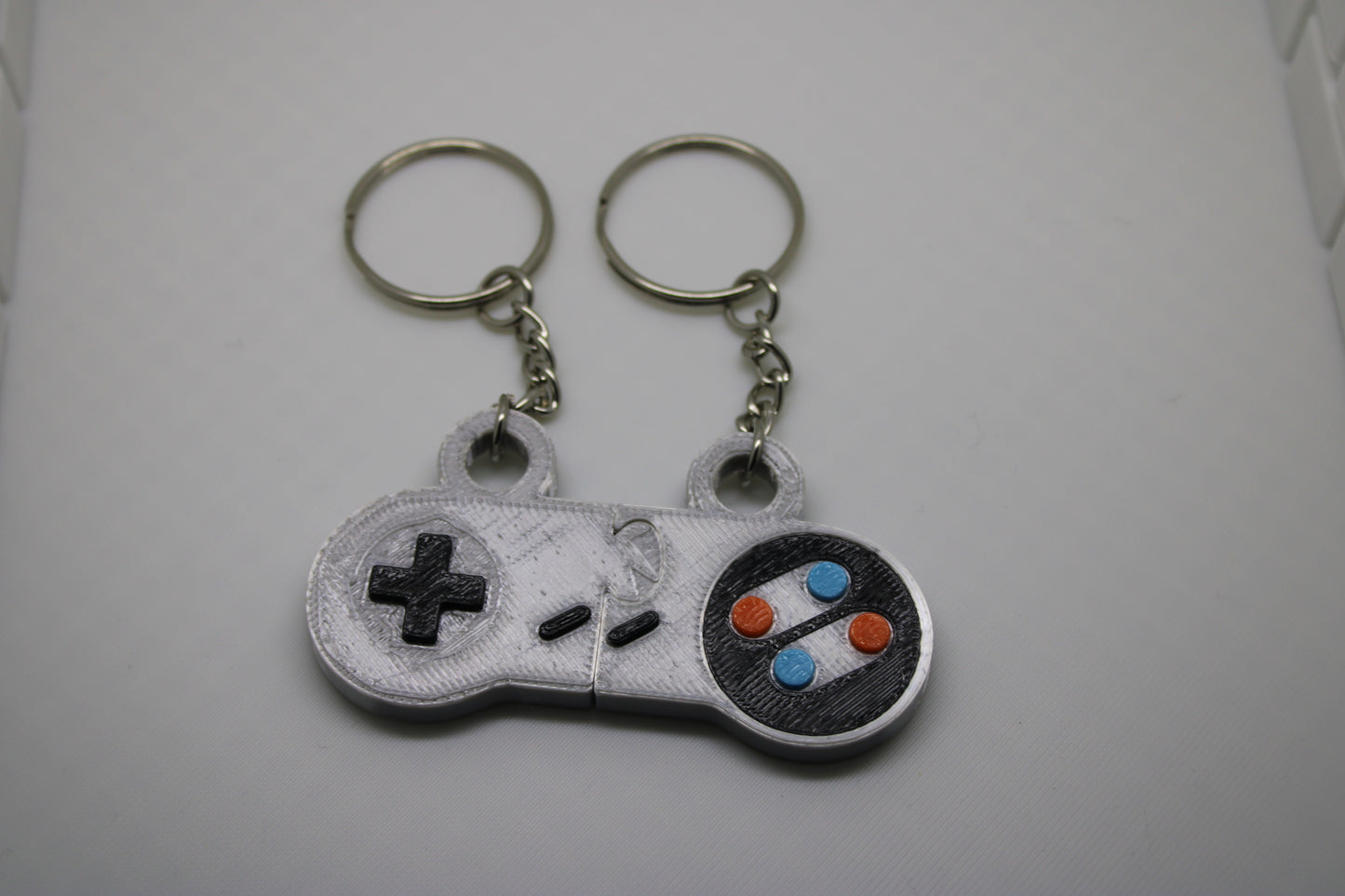 Retro Gamer's Dream: SNES Controller Matching Keychain Set